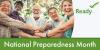 A group of older adults smiles with their hands together. National Preparedness Month.